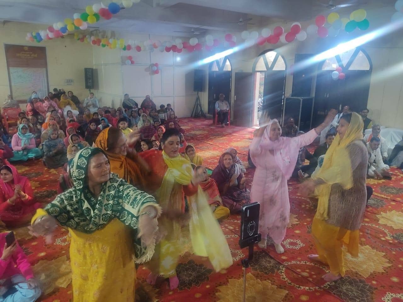 Women dancing during a Sanstha programme