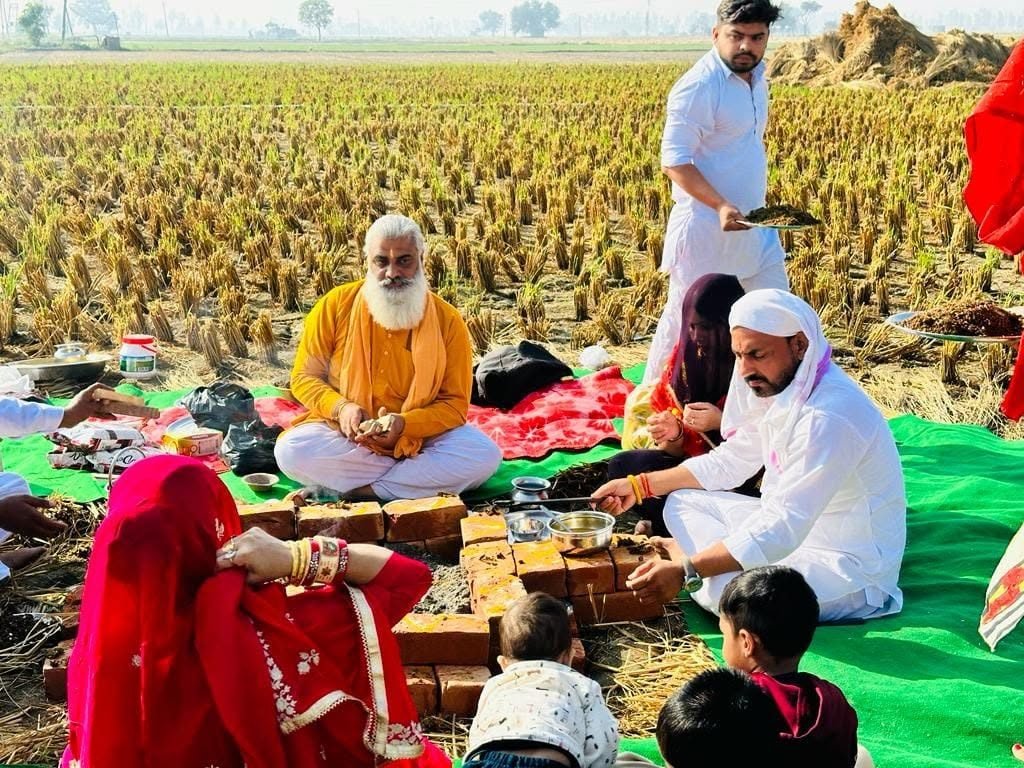 A havan held in a harvested field near Safidon